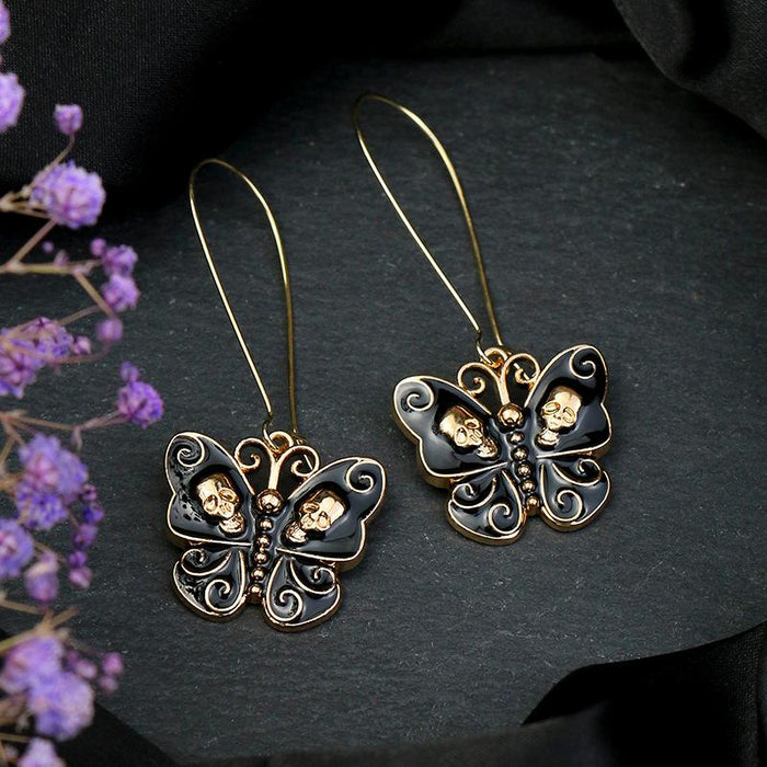 White Gold Black Oil Dripping Butterfly Alloy Skull Standing Ear Ornament