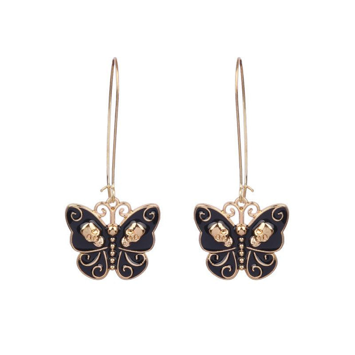 White Gold Black Oil Dripping Butterfly Alloy Skull Standing Ear Ornament