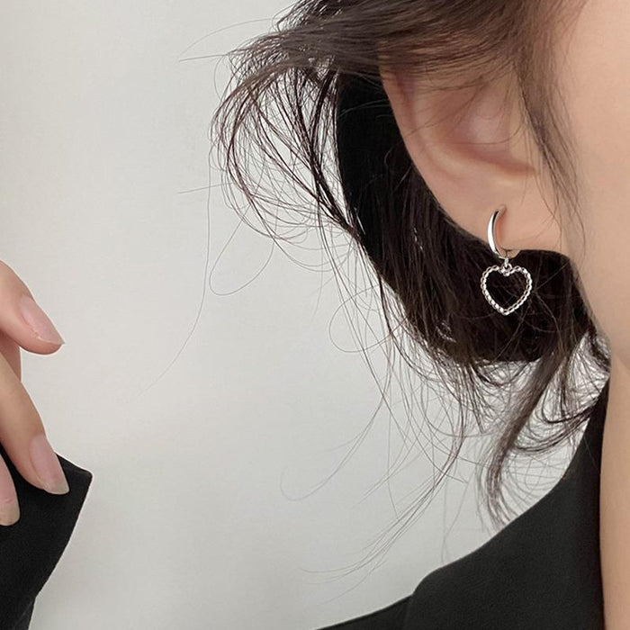 Asymmetric heart earrings