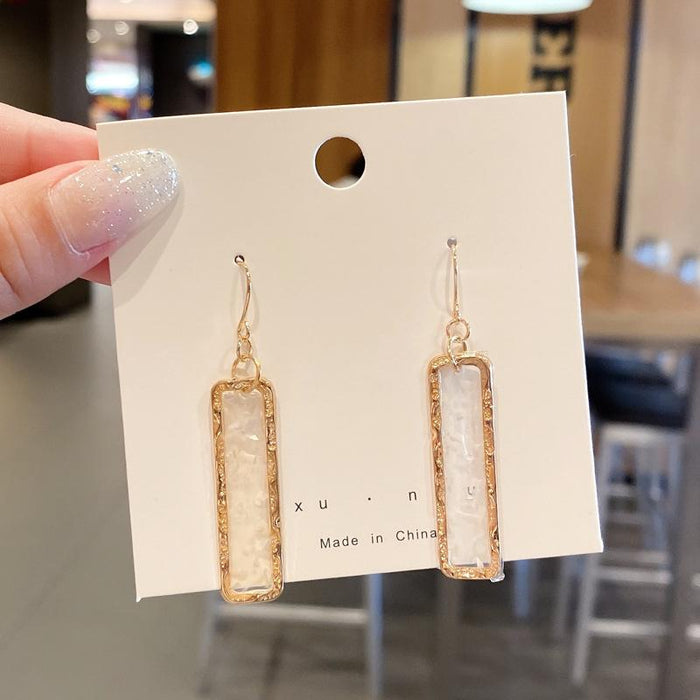 Fringed exaggerated earrings