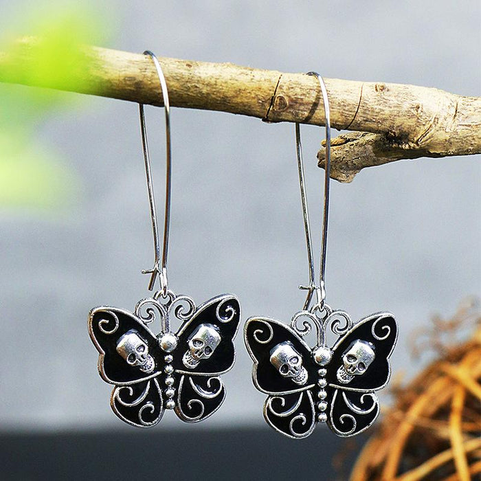 White Gold Black Oil Dripping Butterfly Alloy Skull Standing Ear Ornament